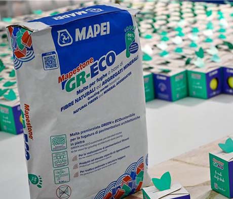 Mapei e Smurfit Kappa Italia: packaging sostenibile all’insegna delle mele