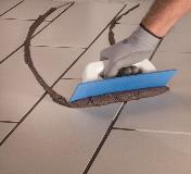 Kerapoxy CQ  being applied to installed tiles
