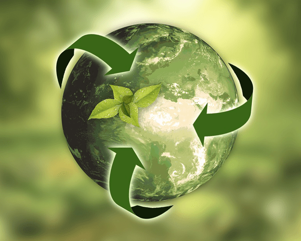 Environmentally-friendly concept image - globe wrapped in green arrows