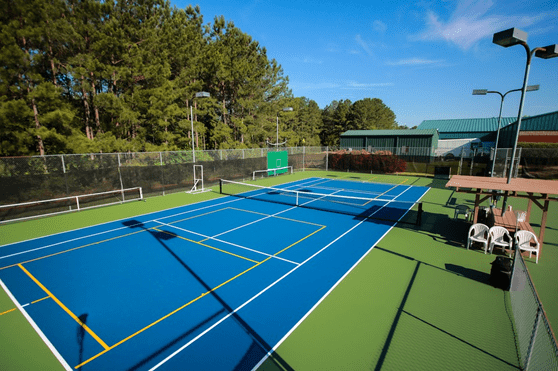 hard tennis court with additional markings for other sports